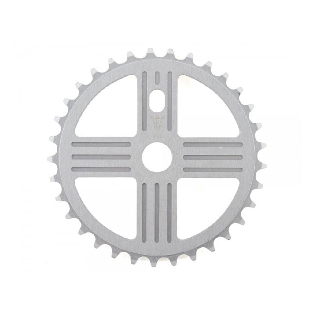 The MCS Neptune Helm Chainwheel is a silver chainring with 36 teeth, featuring a symmetrical design with cutouts and grooves.