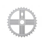 The MCS Neptune Helm Chainwheel is a silver chainring with 36 teeth, featuring a symmetrical design with cutouts and grooves.