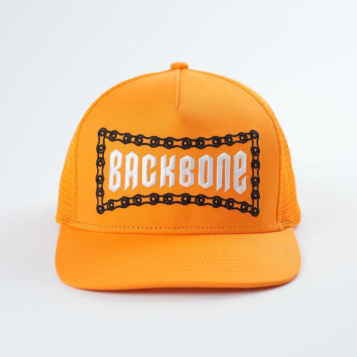 The Backbone No Weak Links Trucker Hat is an epic orange cap featuring "BACKBONE" in bold white letters framed by a striking chain design.