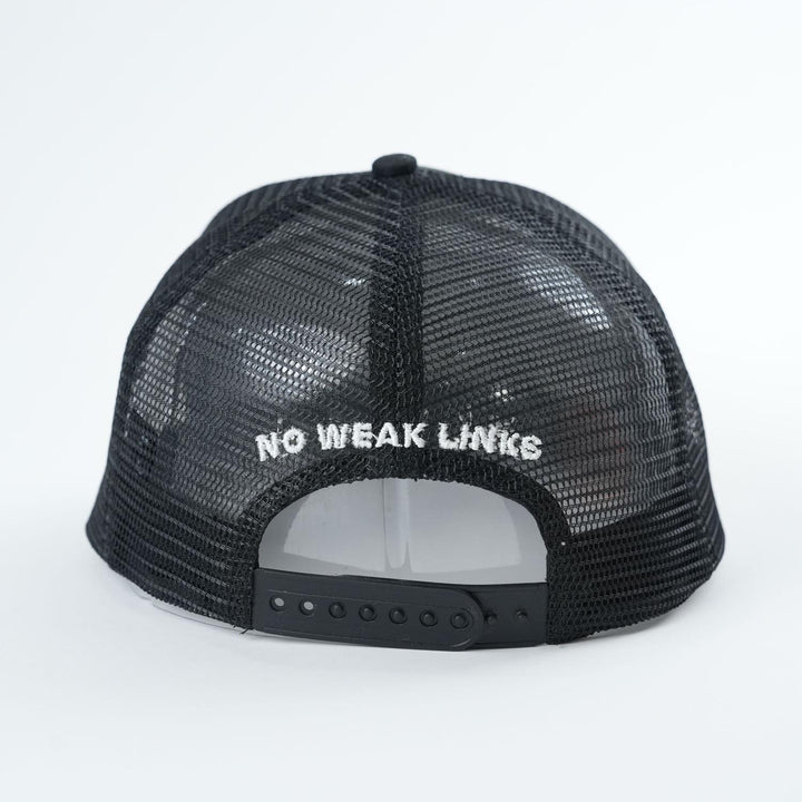 The Backbone No Weak Links Trucker Hat features a black mesh design with "NO WEAK LINKS" embroidered in white above the adjustable strap.