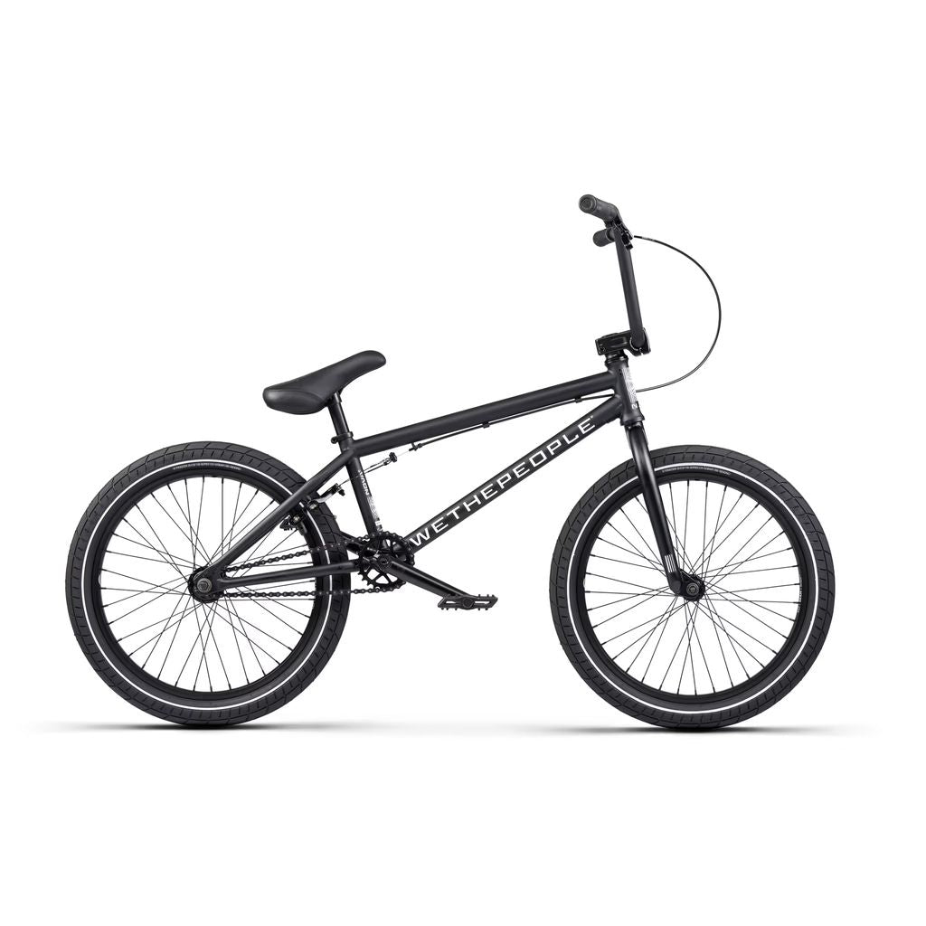 The Wethepeople Nova 20 Inch Bike boasts thick tires, a straight top tube, and single gear. It comes with Salt Rookie Tubular Chromoly Cranks for durability and handlebar brakes for smooth control, all on a sleek black frame proudly displaying the brand name.