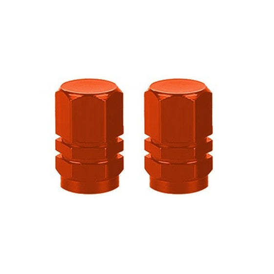 The Hexagon Valve Caps, shown in vibrant orange against a plain white background, add a splash of color to your ride.