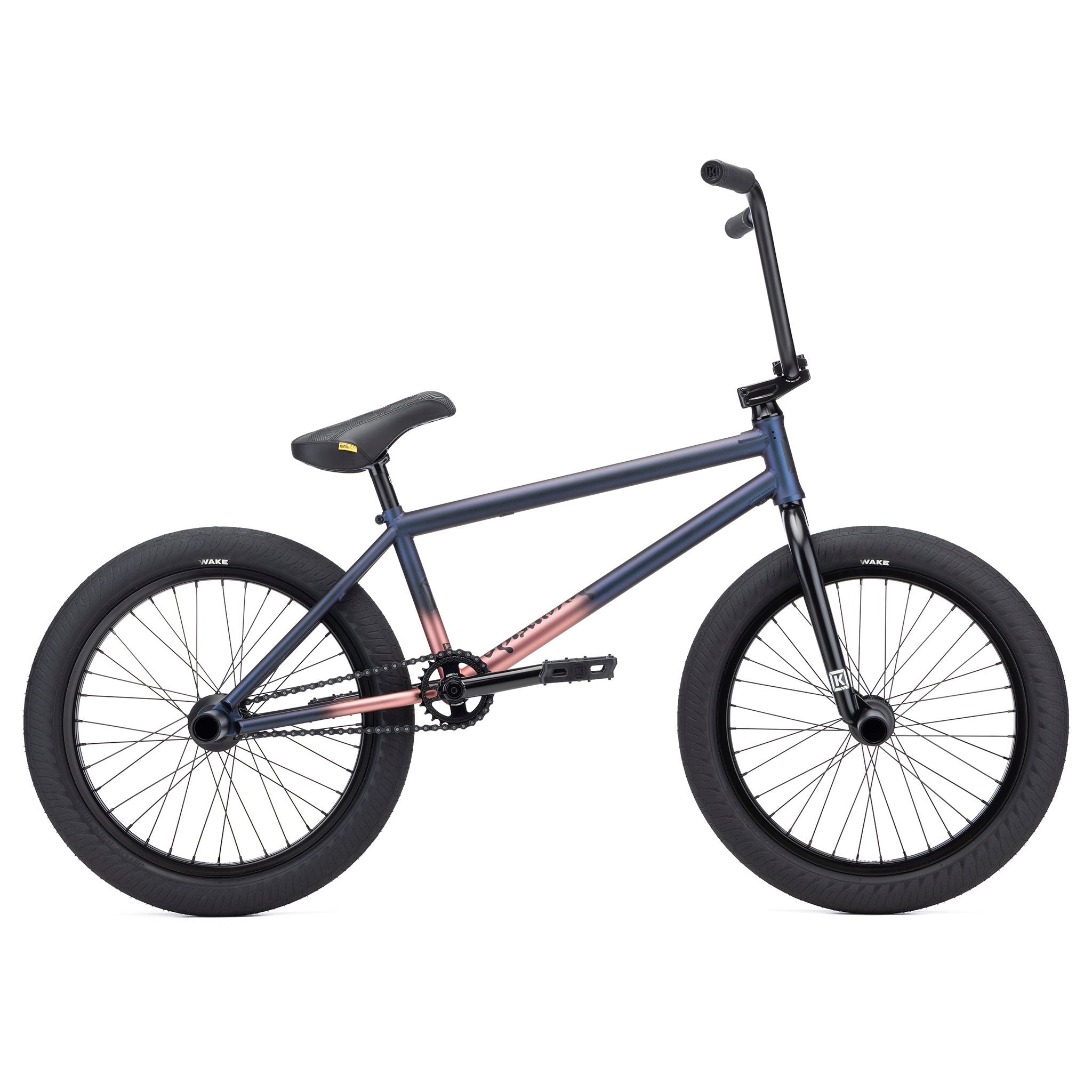 The Kink Downside 20 Inch Bike (2026) boasts a durable chromoly frame in dark blue and pink, along with sleek black handlebars and tires, ideal for exciting BMX riding adventures.