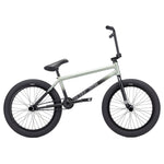 The Kink Switch 20 Inch Bike (2026) is a sleek silver BMX bike featuring black handlebars, seat, and tires. It boasts a simple chromoly frame design with a bottom tube sticker, showcased in side view on a white background for clarity.