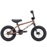 The Kink Roaster 12 Inch Bike (2026) features a brown metallic frame, black seat, and black tires, making it an ideal first BMX bike for kids.