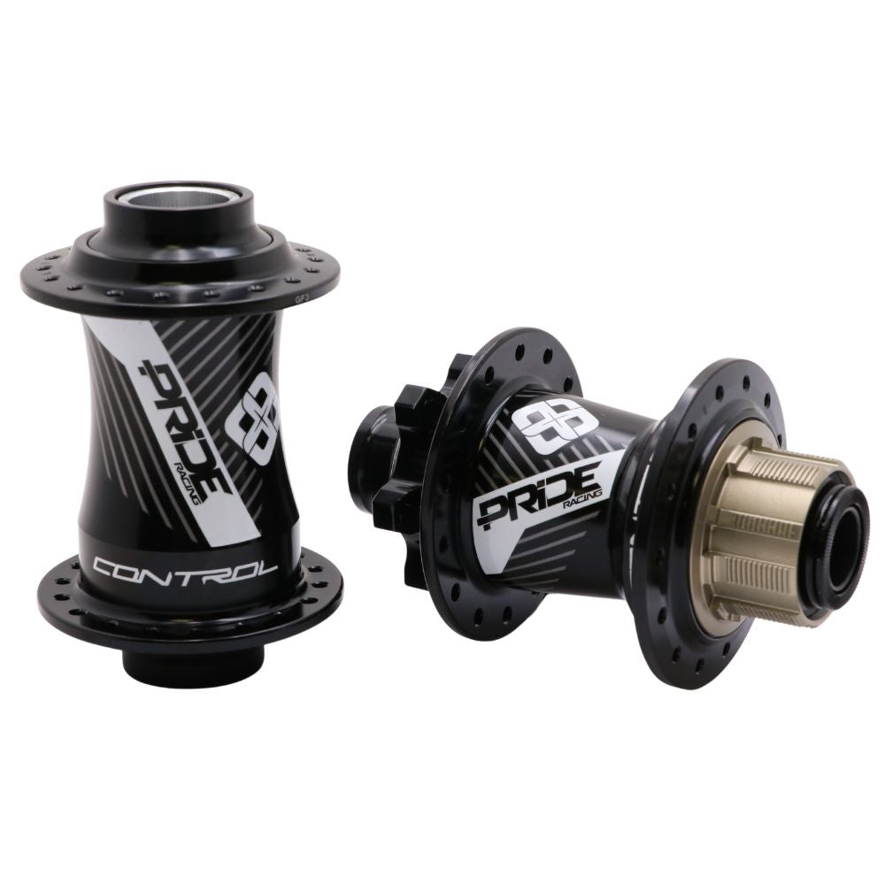 Showcased on a white background are two sleek BMX racing hubs in black with silver accents, both part of the Pride Control V2 Pro 36H 15mm Hubset. Expertly CNC machined for precision and disc brake ready, they blend craftsmanship with performance.