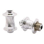 The Pride Control V2 Pro 36H 15mm Hubset includes two CNC machined silver bicycle hubs featuring etched patterns and multiple spoke holes, one equipped with a cassette body, ideal for BMX racing.