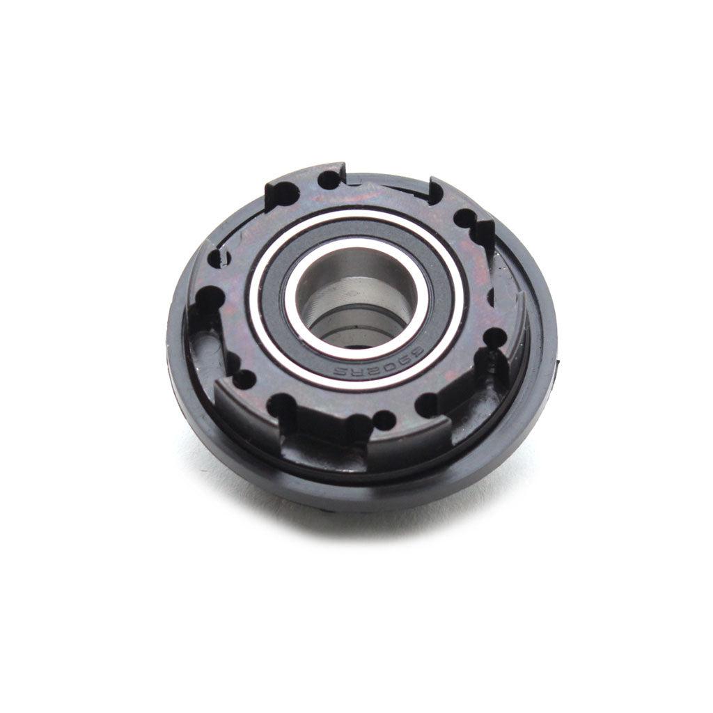 A round mechanical component featuring a central bearing and textured outer edge, commonly used in machinery like the Profile Cassette Driver Cro-Mo designed for Elite Hubs.