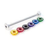 The Profile Mini Stem Lock features a metal axle with a silver finish positioned above six assorted colored washers, each engraved with text and neatly aligned. The design includes adjustable locking elements to ensure stability and precision.