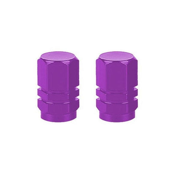 The Hexagon Valve Caps (Pair) boast a vibrant purple color and sleek metallic finish, adding style to every ride.