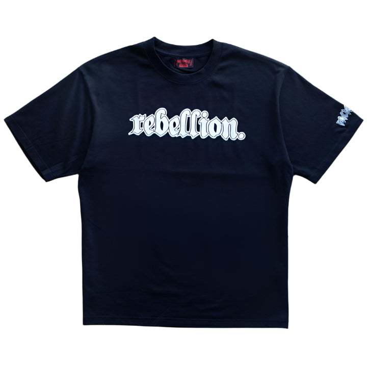 The Backbone Rebellion T-Shirt showcases "rebellion" in white Gothic font, crafted from a heavyweight 240 GSM fabric. Its boxy fit effortlessly combines bold style with comfort.