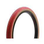 Red bicycle tire with a black inner lining and beige sidewalls, featuring an original tread pattern. This Panaracer Freestyle HP Tyre is designed for 85 PSI performance.