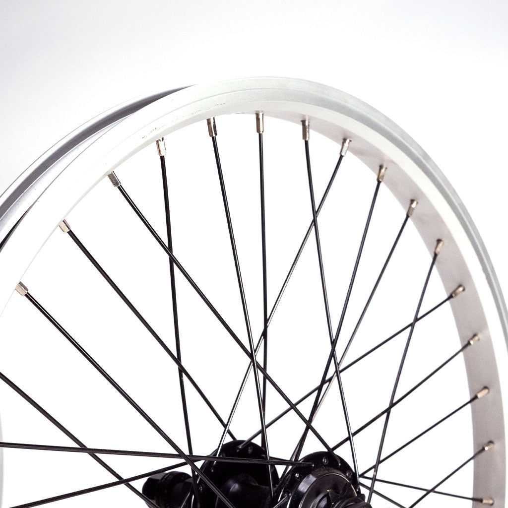 Close-up of a Redline RL 20 B Complete wheelset with a silver double wall rim and black spokes, featuring a 14mm axle, against a plain white background.