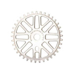 Circular metal gear with evenly spaced teeth and a series of cut-out patterns along the inner section. Crafted from 7075-T6 Aluminium, this Rennen Alloy Race Sprocket 44T (19mm) features text reading "Portland Design Group 31T/705".