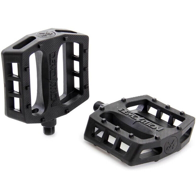 The Demolition Trooper PC Pedal pair, featuring a textured surface and an open rectangular design for superior grip, is showcased against a white background.