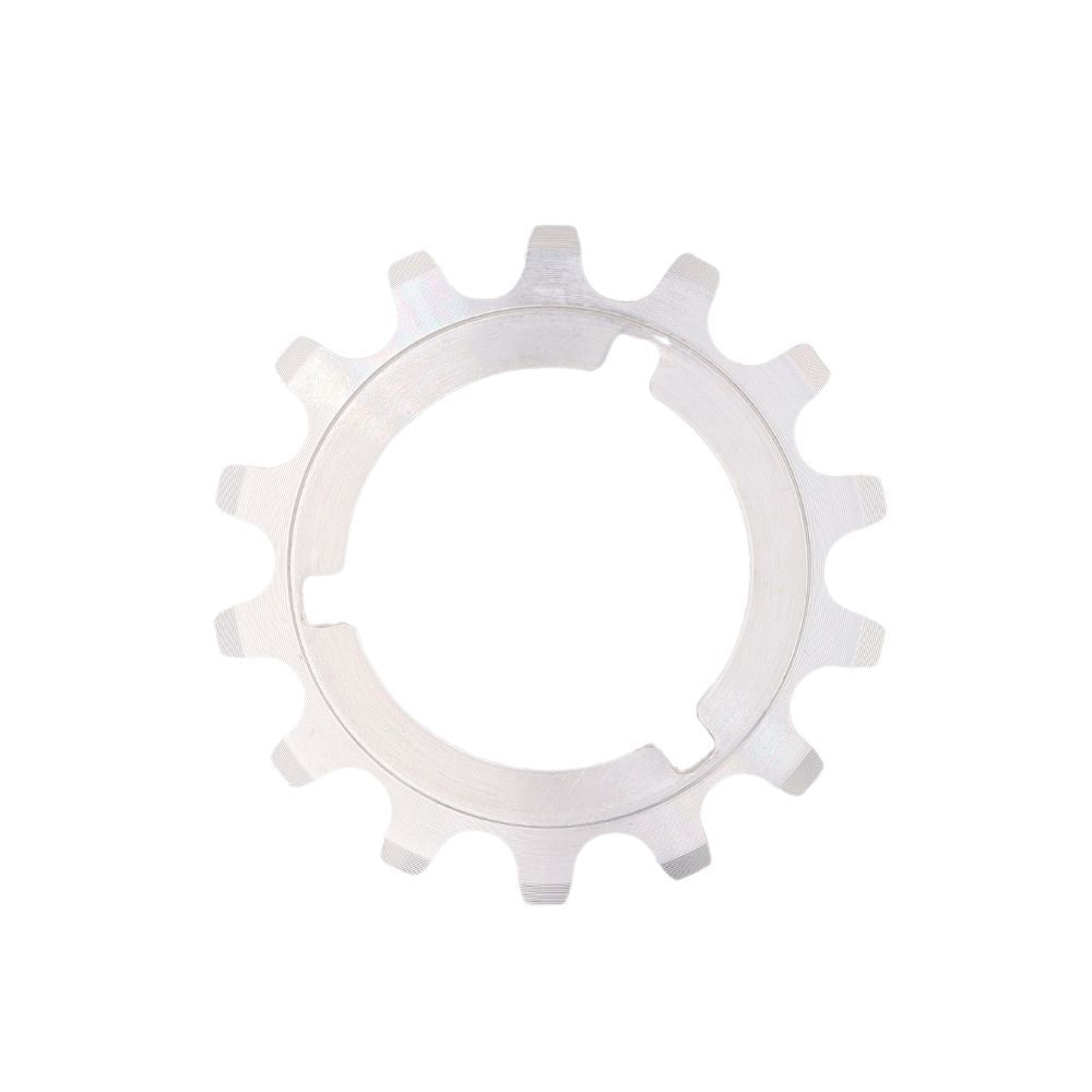 A CNC machined, silver metal sprocket with 11 teeth and a circular central hole rests against a white background. Ideal for Pro/Elite riders, this SD-X Sniper Alloy Cog promises precision and durability.