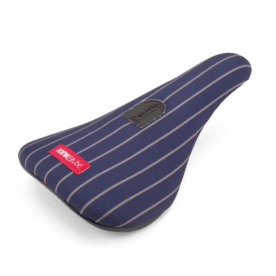 The Kink Pinstripe Pivotal Seat features a blue and white pinstripe fabric cover with a red label, reminiscent of a classic design.