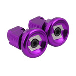 The Snafu Alloy Stubby Bar Ends are purple aluminum bicycle handlebar end plugs made from cold forged alloy, with hex bolts and a striking silver geometric design on the caps.