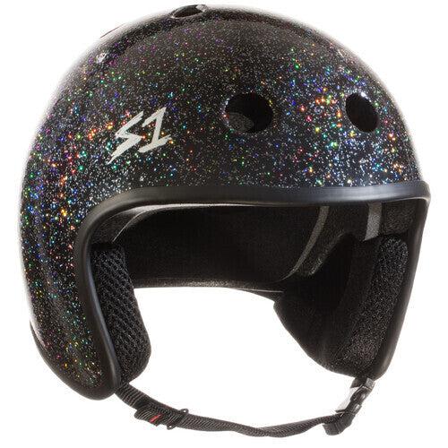 The S-One Helmet Retro Lifer Black Gloss Glitter is a black BMX helmet with a sparkling glitter finish, foam padding inside, ventilation holes on the front, and an adjustable chin strap. This multi-impact helmet ensures safety and style for all your journeys.