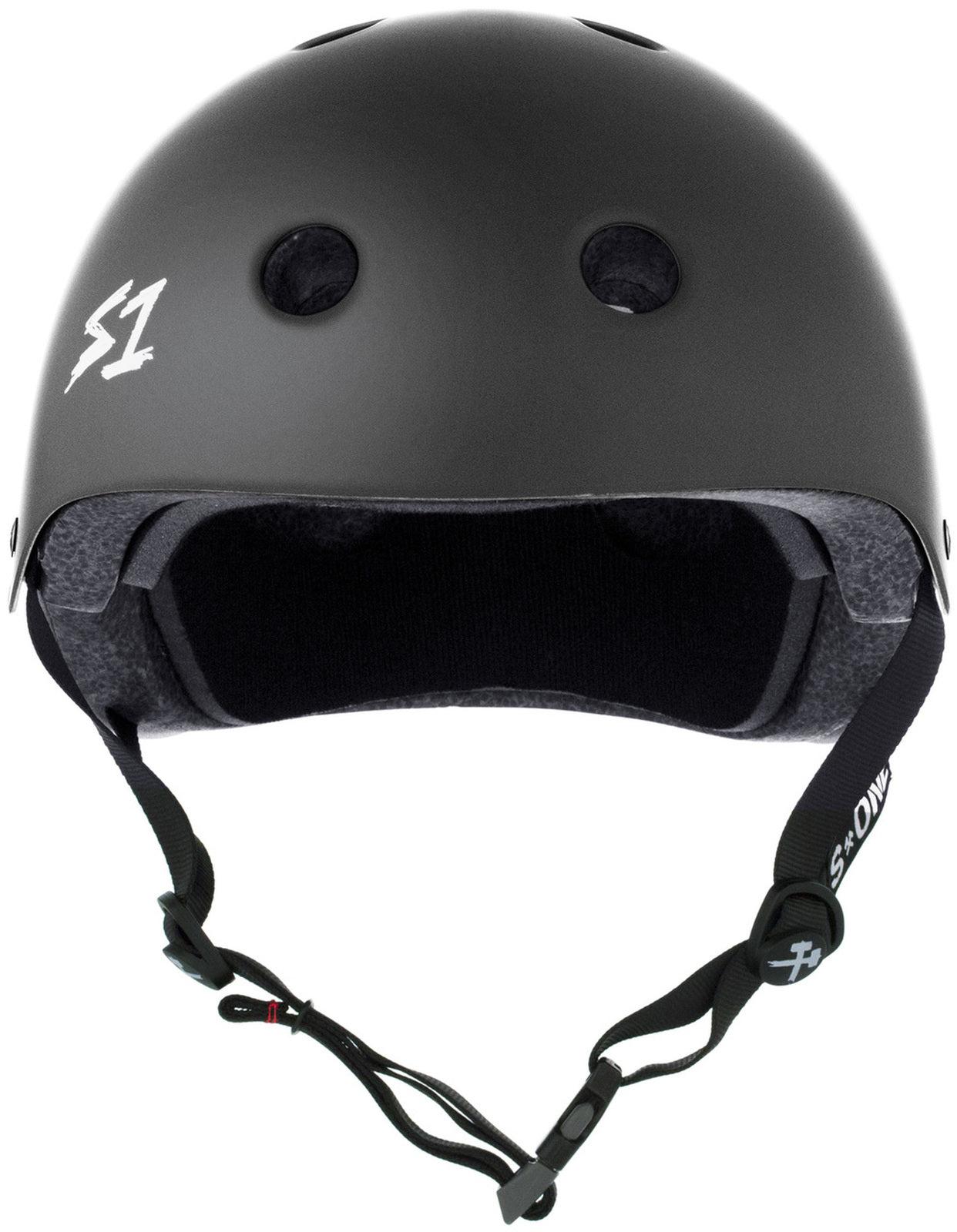 A dark grey matte multi-impact helmet with ventilation holes and adjustable straps, featuring the logo "S1" on the front left side.