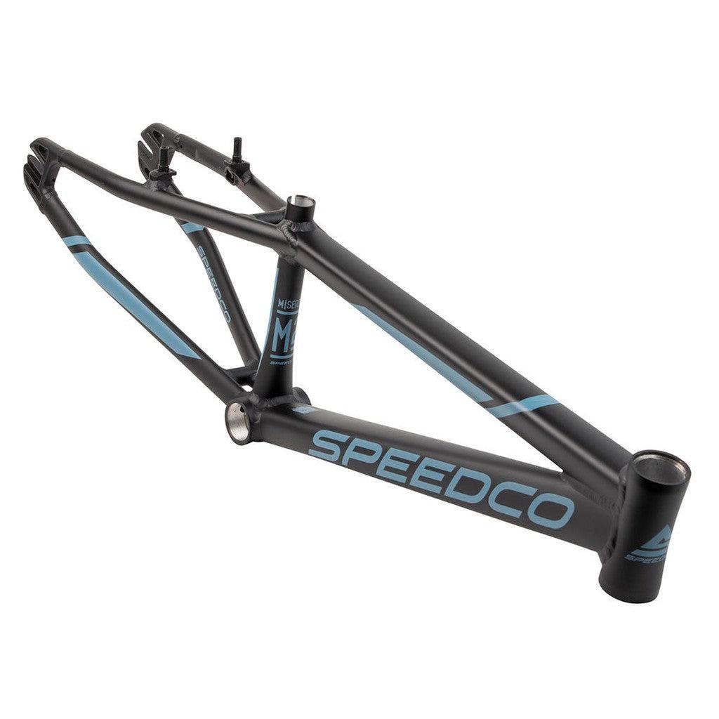 A black and blue Speedco 2024 M2 Expert Cruiser Frame with no wheels or handlebars, designed for BMX racing. The aluminium frame features a comprehensive geometric design for strength and performance, fully compatible with V-brake systems.