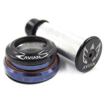 Here's a revised version of the sentence using the provided product data:

Close-up of a bicycle headset and grip, featuring "AVIAN" branding. The Avian Integrated Tapered Headset showcases blue and black colors, while the grip boasts a textured surface alongside the logo. This model includes a stylish carbon top cover for an enhanced aesthetic.