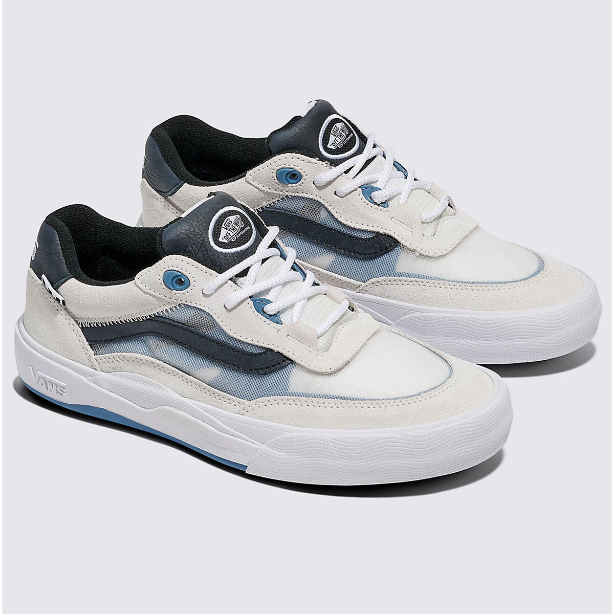 A pair of Vans Skate Wayvee Shoes Blanc De Blanc, trendy with white and gray tones, black accents, a black inner lining, and signature Waffle Cup soles, displayed on a light gray background.