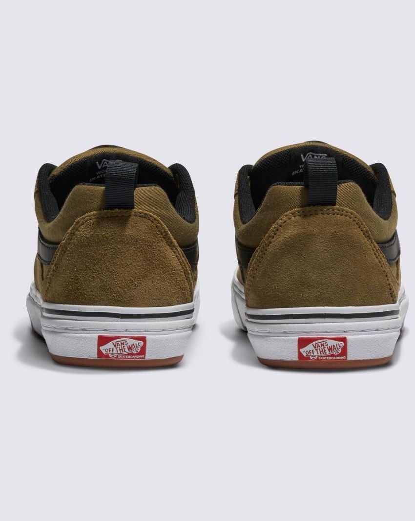 A pair of Gothic Olive suede sneakers with white soles, viewed from the back, featuring the Vans "Off The Wall" logo on the heels. These Vans Pro Skate Kyle Walker shoes boast DURACAP™ reinforcements for added durability and WAFFLECUP™ outsoles for superior grip and boardfeel.